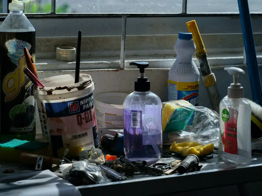 Assorted cleaning and washroom supplies on a counter
