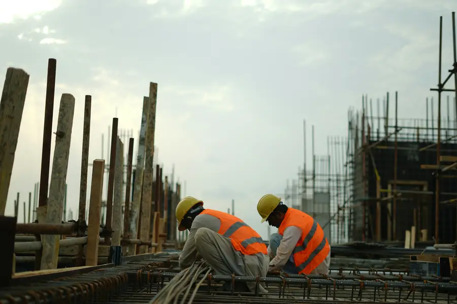 Construction crew in hi-vis working on site
